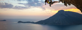 rock climber at sunset with beautiful ocean view